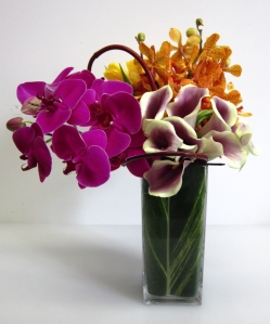 Picasso calla lilies, hot pink phalaenopsis orchids and orange mokara orchids